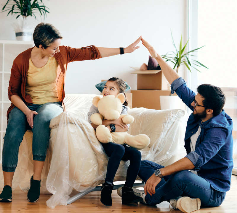 happy-family-having-fun-while-moving-into-their-new-home 1